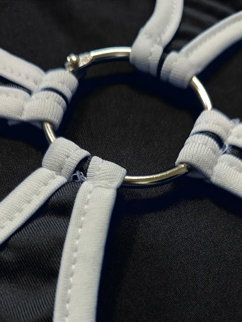 Close-up of floral cut-out detail with ring accent on women's shorts set